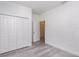 Bedroom with view to bathroom, open closet and neutral walls at 2808 Sw 139Th St, Ocala, FL 34473