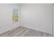 Bright bedroom featuring light wood flooring and a window offering natural light at 2808 Sw 139Th St, Ocala, FL 34473