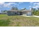 Inviting single-Gathering home featuring a well-maintained lawn, spacious driveway, and an attached two-car garage at 2808 Sw 139Th St, Ocala, FL 34473