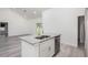 Bright kitchen with island, stainless steel appliances, granite countertops, and open floor plan at 2808 Sw 139Th St, Ocala, FL 34473