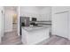 Stylish kitchen with granite counters, stainless steel appliances and white cabinetry at 2808 Sw 139Th St, Ocala, FL 34473