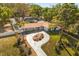 An elevated shot of the home showing the grounds, the circular drive, and the manicured lawn at 2945 Southgate Ter, Orlando, FL 32818