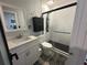 Updated bathroom featuring modern fixtures, including a large shower with a multi-spray panel at 2945 Southgate Ter, Orlando, FL 32818