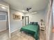 Bedroom with tile floors, modern ceiling fan and lighting, and closet at 2945 Southgate Ter, Orlando, FL 32818