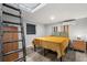 Bedroom with wood-look flooring, rustic ladder access to a loft, and modern window shades at 2945 Southgate Ter, Orlando, FL 32818