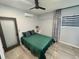 Bedroom with tile floors, modern ceiling fan and lighting, and closet at 2945 Southgate Ter, Orlando, FL 32818
