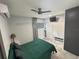 Bedroom with tile floors, modern ceiling fan and lighting, and closet at 2945 Southgate Ter, Orlando, FL 32818
