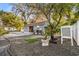 Charming blue exterior home surrounded by mature trees and unique landscaping elements at 2945 Southgate Ter, Orlando, FL 32818