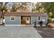 Charming single-story home with brick-paved driveway, and well manicured landscaping at 2945 Southgate Ter, Orlando, FL 32818