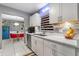 Updated kitchen showcases white cabinetry, stainless appliances, and stylish tile backsplash at 2945 Southgate Ter, Orlando, FL 32818