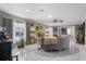 Bright and airy living room with neutral decor and large windows offering ample natural light at 2945 Southgate Ter, Orlando, FL 32818