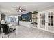 Stylish living room with contemporary decor, large windows, and bright, neutral paint at 2945 Southgate Ter, Orlando, FL 32818