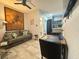 Inviting living room featuring a comfortable couch, dining area, and seamless flow into a modern kitchen, perfect for living at 2945 Southgate Ter, Orlando, FL 32818