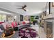 A spacious living room area features a large sofa, art, fireplace and plenty of natural light at 2945 Southgate Ter, Orlando, FL 32818