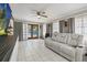 Open living area features tile flooring, large windows, and comfortable seating at 2945 Southgate Ter, Orlando, FL 32818