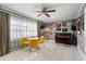 Stylish living area boasts large window, a ceiling fan, tile flooring, and unique decor at 2945 Southgate Ter, Orlando, FL 32818