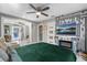 Main bedroom suite features modern accents, a tv, and backyard pool access at 2945 Southgate Ter, Orlando, FL 32818