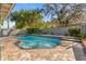 Lovely backyard pool featuring a brick patio area surrounded by mature trees and landscaping, offering a private oasis at 2945 Southgate Ter, Orlando, FL 32818