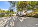 Ample parking space with pavers for RV or other vehicles, shaded by mature trees at 2945 Southgate Ter, Orlando, FL 32818