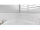 White bathroom featuring a white tiled bathtub and shower combination at 306 Balfour Dr, Winter Springs, FL 32708