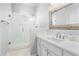 Bright bathroom featuring a walk-in shower with white subway tile and a modern sink with white cabinets at 306 Balfour Dr, Winter Springs, FL 32708