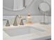 Bright bathroom showcasing a white marble countertop and vanity mirror with modern fixtures at 306 Balfour Dr, Winter Springs, FL 32708
