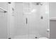 Walk-in shower featuring white subway tile and a herringbone-patterned floor, offering a modern and clean design at 306 Balfour Dr, Winter Springs, FL 32708