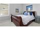 Bedroom with shuttered window and framed art at 306 Balfour Dr, Winter Springs, FL 32708