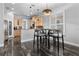 Bright kitchen with wood cabinets, pendant lighting, and a convenient breakfast bar for casual dining at 306 Balfour Dr, Winter Springs, FL 32708