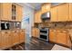 Well-equipped kitchen featuring granite countertops, stainless steel appliances, and ample cabinet space at 306 Balfour Dr, Winter Springs, FL 32708