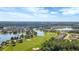 Scenic aerial view of a golf course and residential area, highlighting the community's amenities at 307 Monterey St, Kissimmee, FL 34759