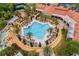 Aerial view of the community pool area, featuring palm trees and various amenities at 307 Monterey St, Kissimmee, FL 34759