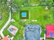 Overhead image features a playground, tennis court, and play area surrounded by green space at 307 Monterey St, Kissimmee, FL 34759
