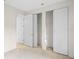 Bedroom featuring a closet and multiple doors at 307 Monterey St, Kissimmee, FL 34759