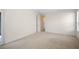 Large bedroom with wall-to-wall carpet, and multiple entry doors at 307 Monterey St, Kissimmee, FL 34759