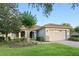 Charming single-story home with tile roof, stone accents, well-manicured lawn and brick paver driveway at 307 Monterey St, Kissimmee, FL 34759
