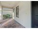 Cozy front porch area with brick pavers offering a glimpse of the home's exterior and landscaping at 307 Monterey St, Kissimmee, FL 34759