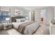 Serene main bedroom with plush bedding, ample natural light, and ensuite bathroom access at 307 Monterey St, Kissimmee, FL 34759
