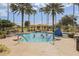 Inviting community pool with palm trees, lounge area and a gazebo, creating a relaxing outdoor space at 307 Monterey St, Kissimmee, FL 34759