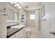 Bathroom with a modern vanity and sink, mirror, and shower with curtain at 3150 Sawgrass Ct, Kissimmee, FL 34746