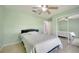 Neutral bedroom featuring a ceiling fan, a full size bed, and a mirrored closet at 3150 Sawgrass Ct, Kissimmee, FL 34746