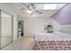 Well-lit bedroom features a closet, bed and a vanity with a lighted makeup mirror at 3150 Sawgrass Ct, Kissimmee, FL 34746