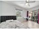 Cozy bedroom with a bed, large window, and sliding glass doors to the pool at 3150 Sawgrass Ct, Kissimmee, FL 34746