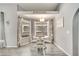 Inviting dining area with white table set, natural light from bright windows, and a view to the outdoor patio at 3150 Sawgrass Ct, Kissimmee, FL 34746