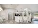A modern kitchen featuring stainless steel appliances, a stylish breakfast bar, and sleek gray cabinets at 3150 Sawgrass Ct, Kissimmee, FL 34746