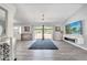 Spacious living room with sleek flooring and abundant natural light from large windows at 3150 Sawgrass Ct, Kissimmee, FL 34746