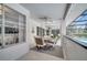 Inviting screened patio featuring a dining table, chairs, and a view of the pool area at 3150 Sawgrass Ct, Kissimmee, FL 34746
