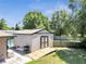 Backyard shed with ramp access, offering ample storage and utility space in the yard at 3150 Sawgrass Ct, Kissimmee, FL 34746