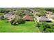 Overhead view of the home showing its large backyard, tidy landscaping, and perimeter white fencing at 3281 Pawleys N Loop, St Cloud, FL 34769