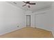 Bright bedroom features a closet with bi-fold doors and a ceiling fan at 3281 Pawleys N Loop, St Cloud, FL 34769